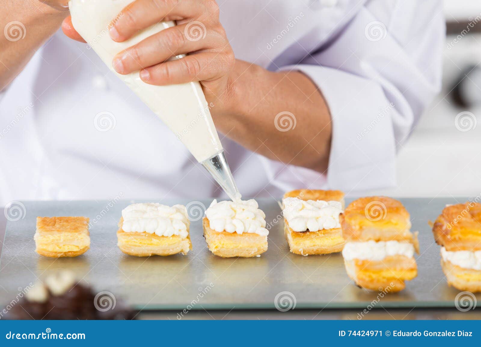 Chef with a pastry bag stock image. Image of garnish 74424971