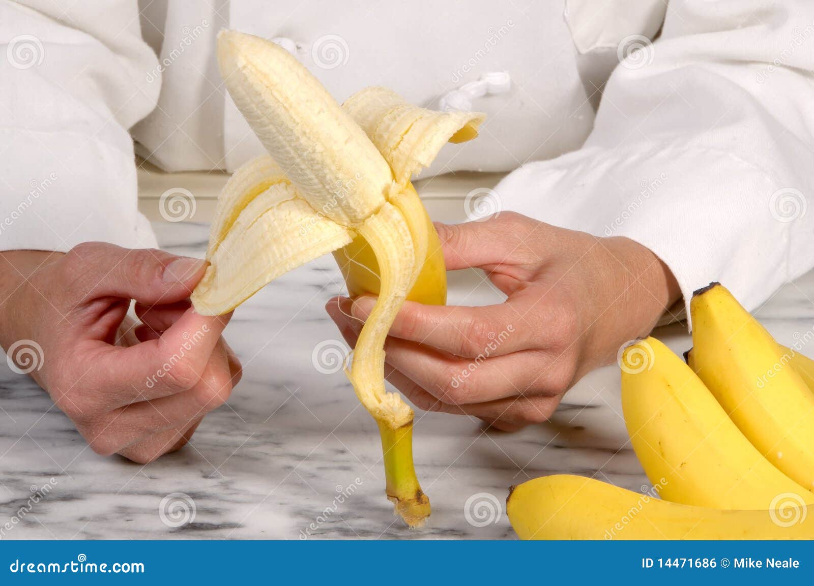 Chef Peeling Banana stock photo. Image of uniform, chef 14471686