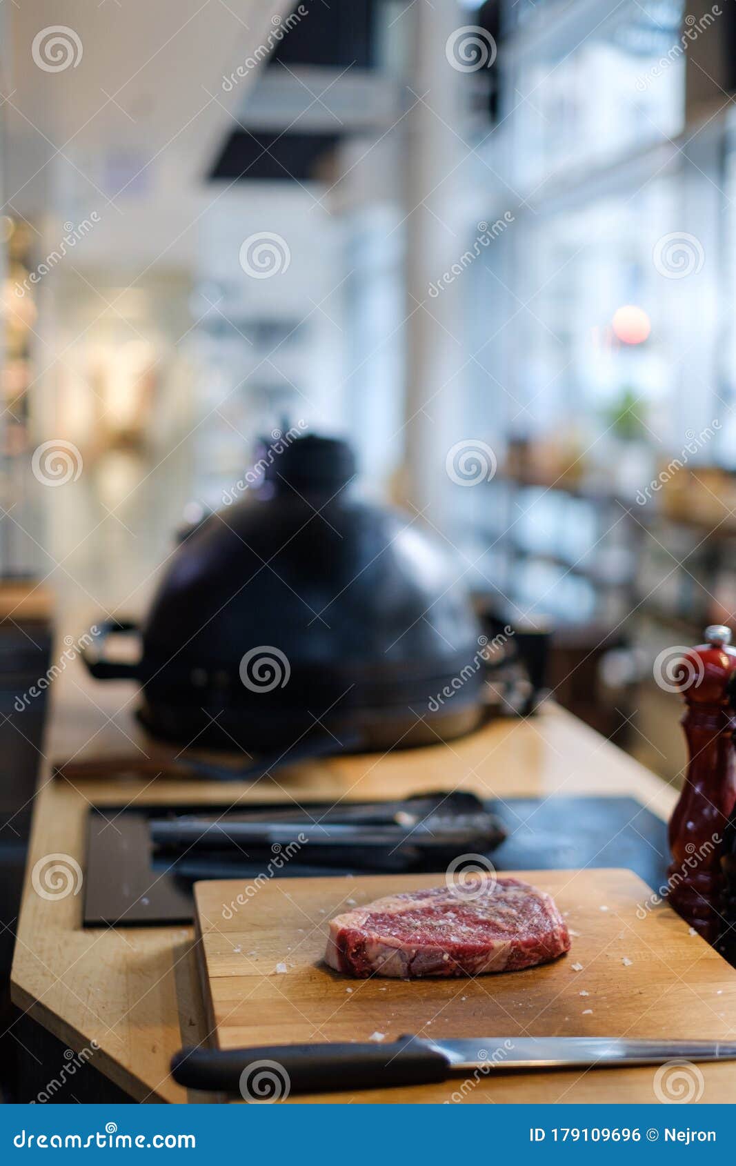 Chef Preparing Charcoals before Grilling in a Restaurant Stock Photo