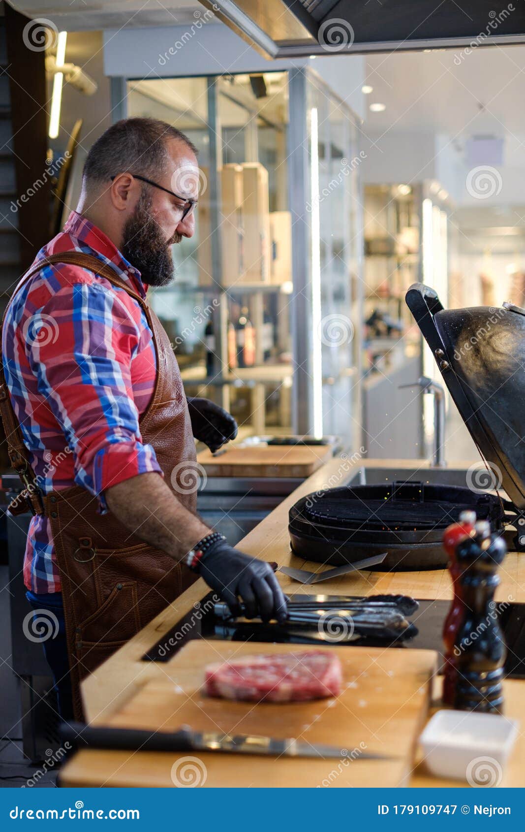 Chef Preparing Charcoals before Grilling in a Restaurant Stock Image