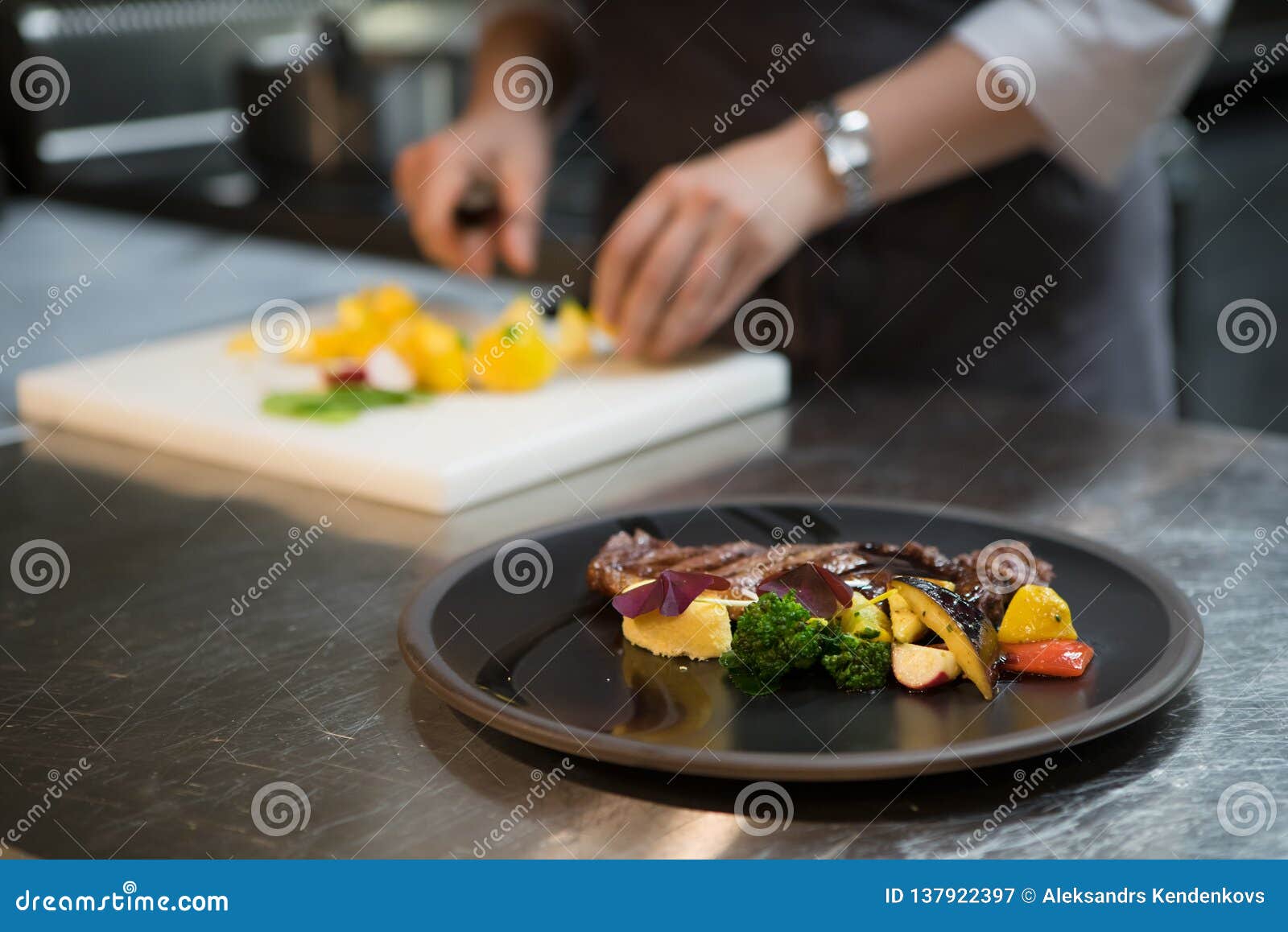 Chef Puts the Dish on a Plate. Preparing To Serve. Stock Image Image