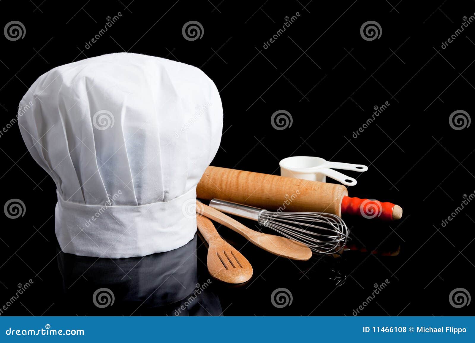 a chef's toque with cooking utensils