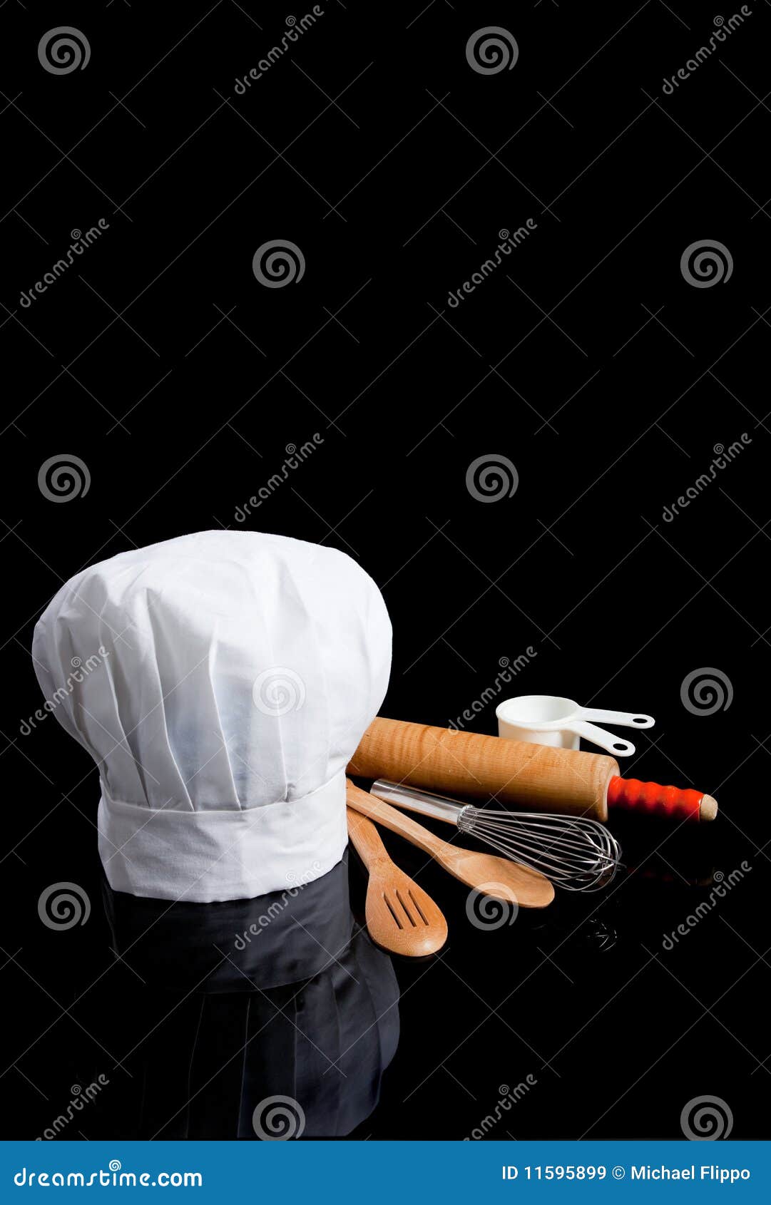 a chef's toque with kitchen utensils on black