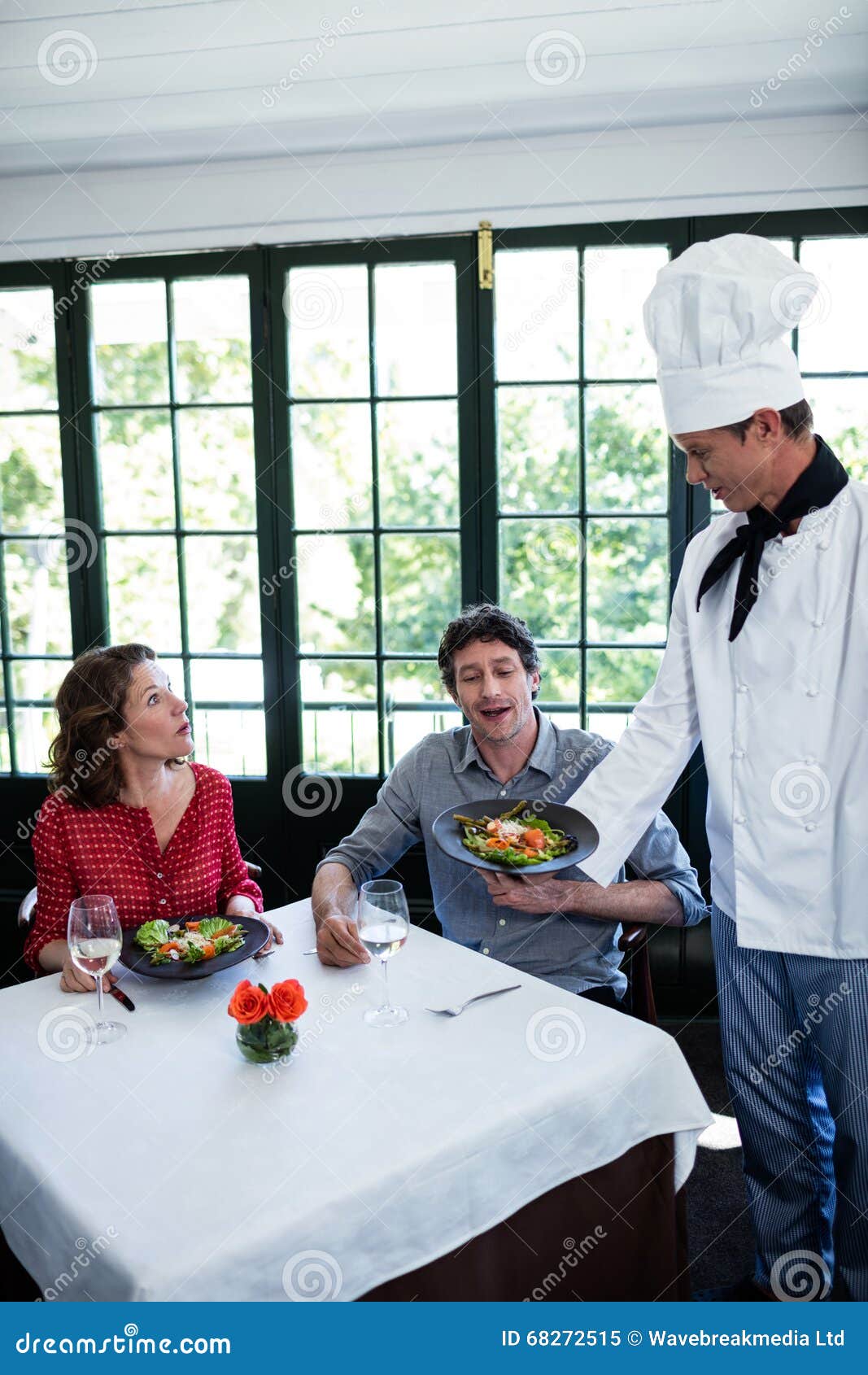 Chef Serving Meal To a Couple Stock Image Image of classy, caucasian