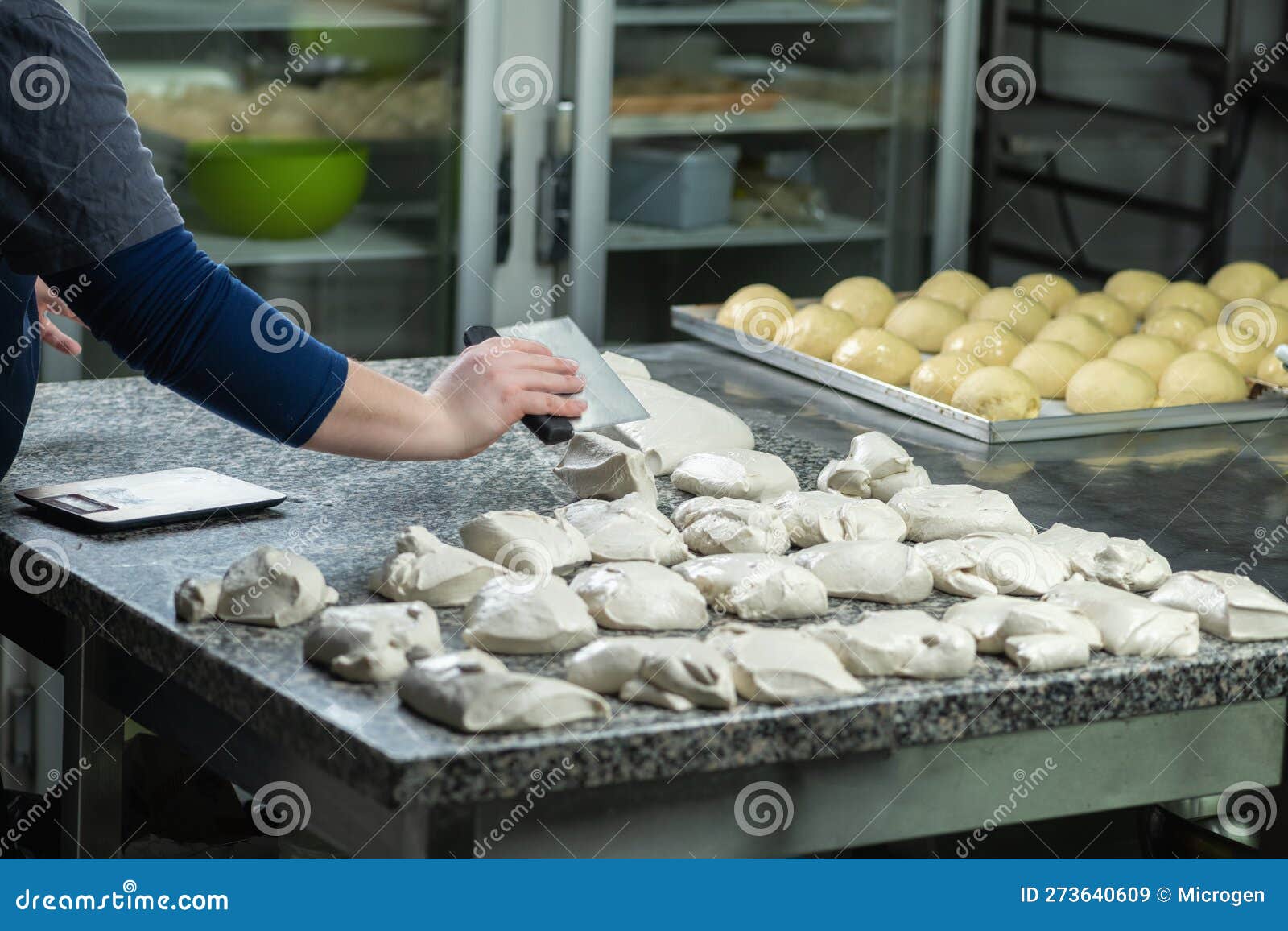 Chefs Hand Preparing Dough for Pizza in Restaurant Kitchen Stock Image