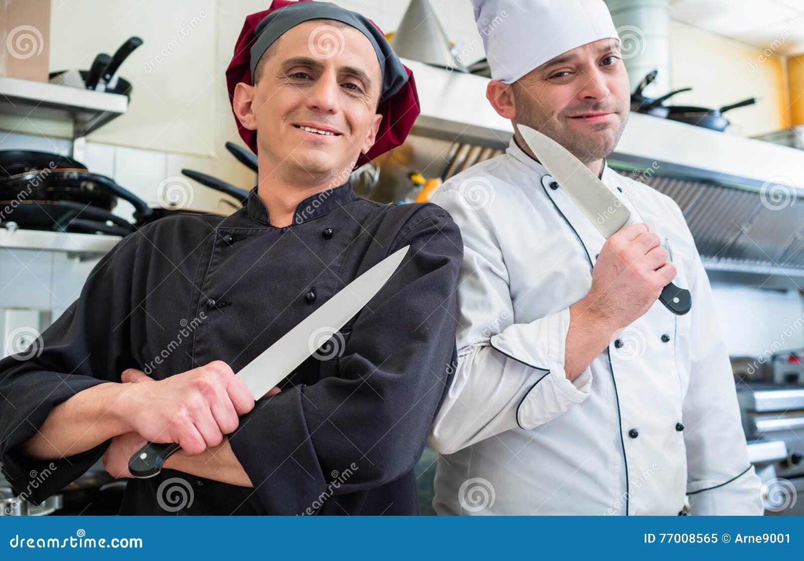 Chefs Posing with Knife in Their Restaurant Kitchen Stock Image Image