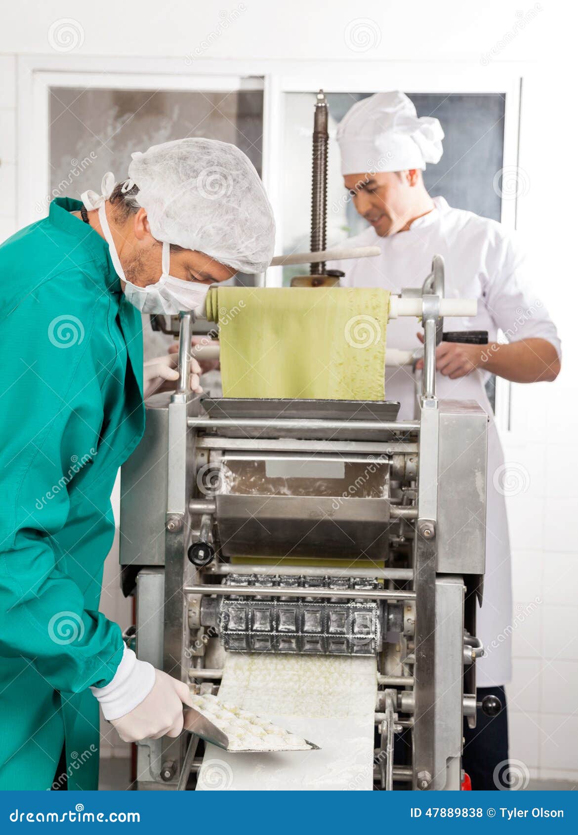 Chefs Processing Ravioli Pasta in Machine Stock Photo Image of