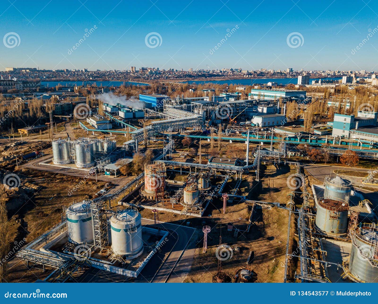 chemical factory industrial area. aerial view. large vats connected by pipeline