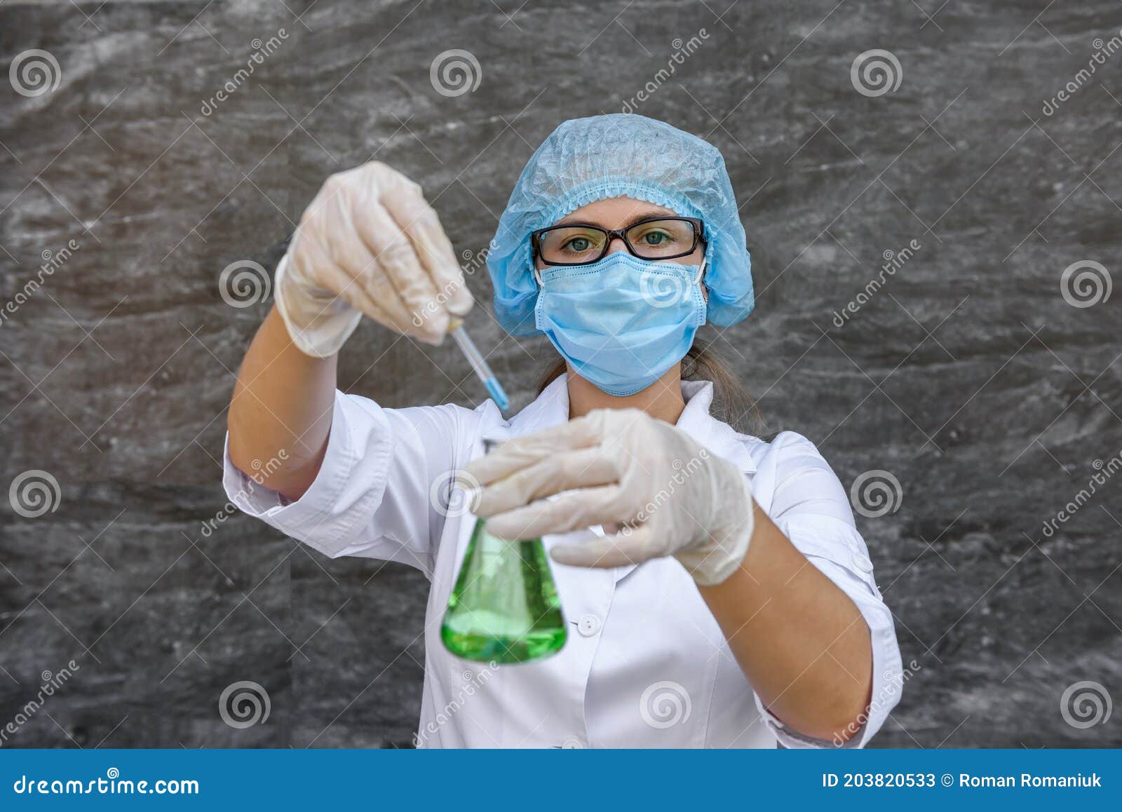 Chemist with Flask Making Scientific Experiment. she`s in Protective