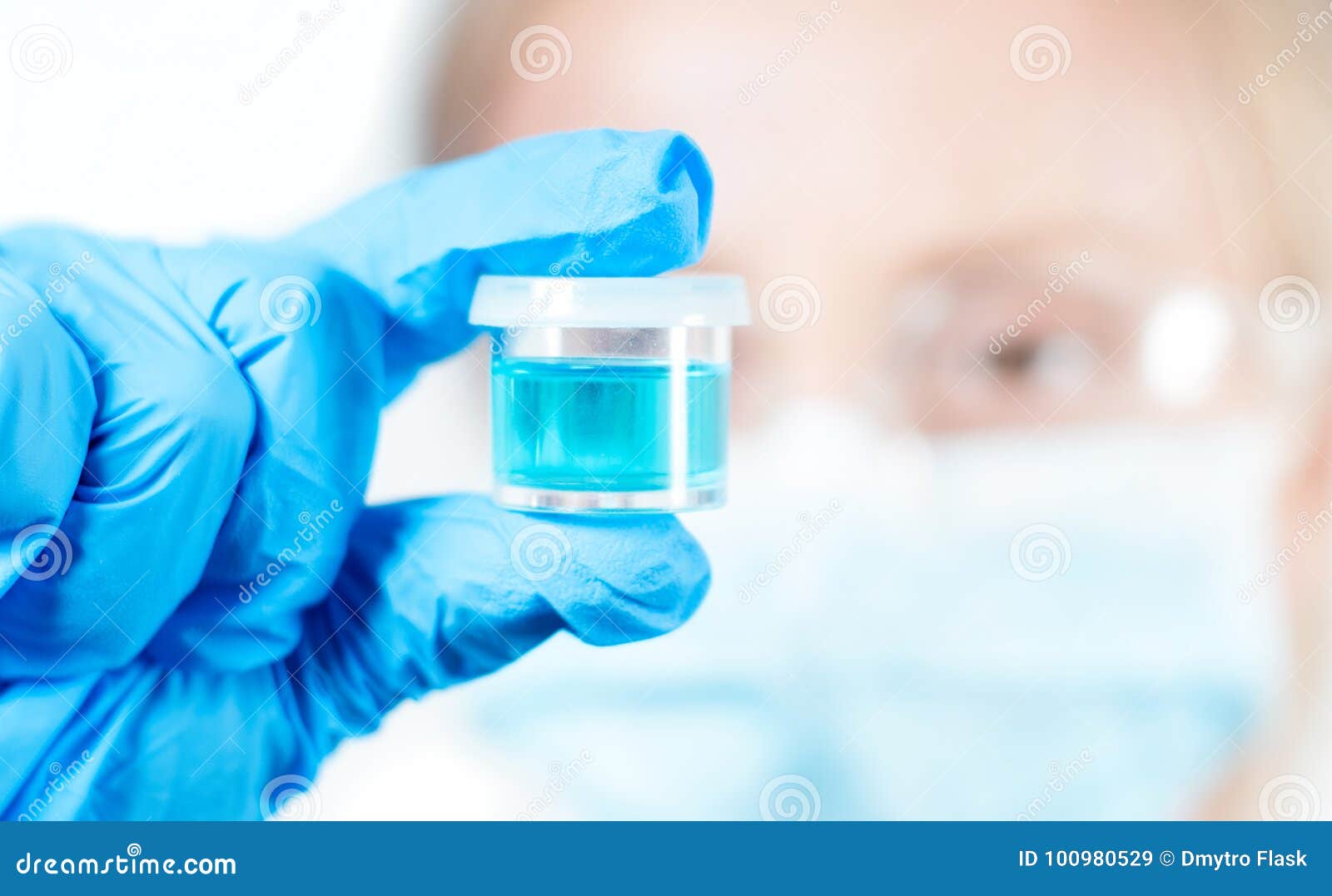 Chemist in Protective Eyeglasses Holding Test Tube with Reagent in Lab ...