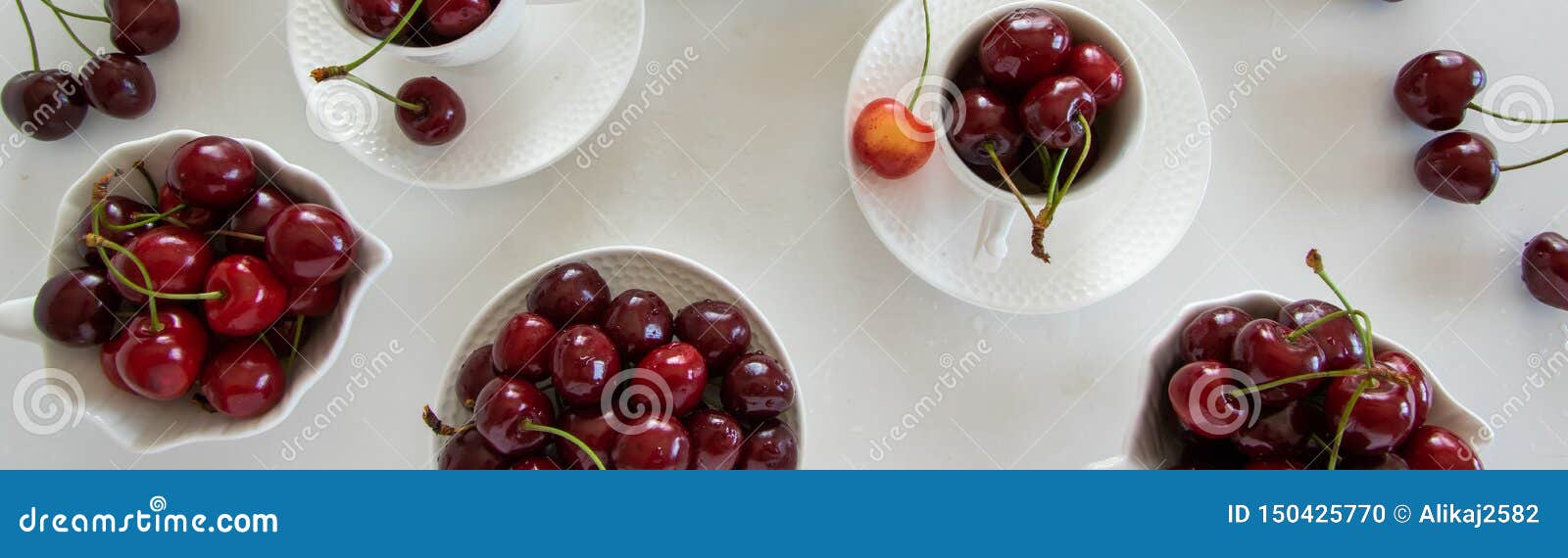 Cherries Season. Top View of Raw Cherries in White Cups Stock Photo