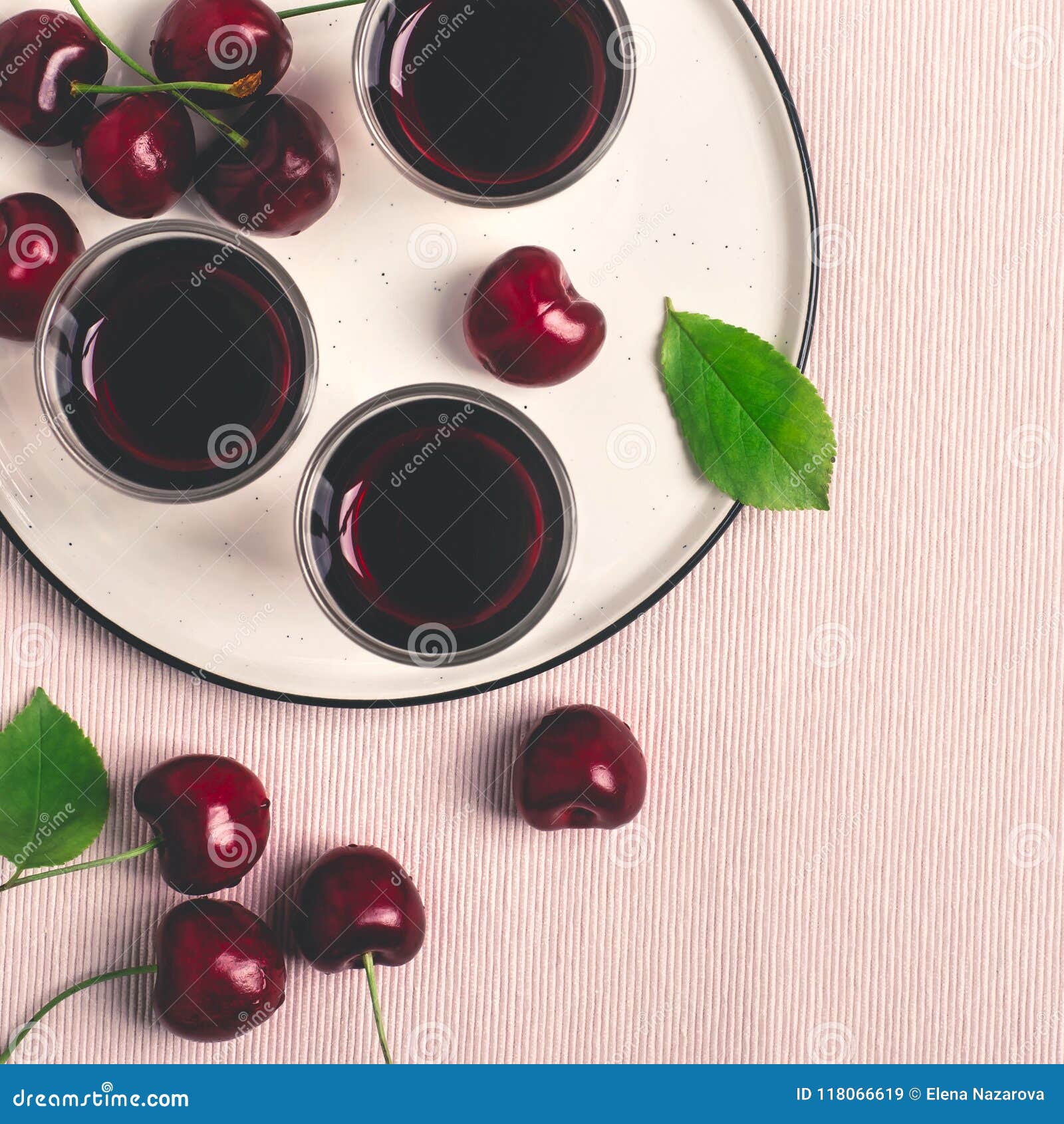 Cherry Alcohol Drink Liquor or Brandy on Pink Background Stock Image
