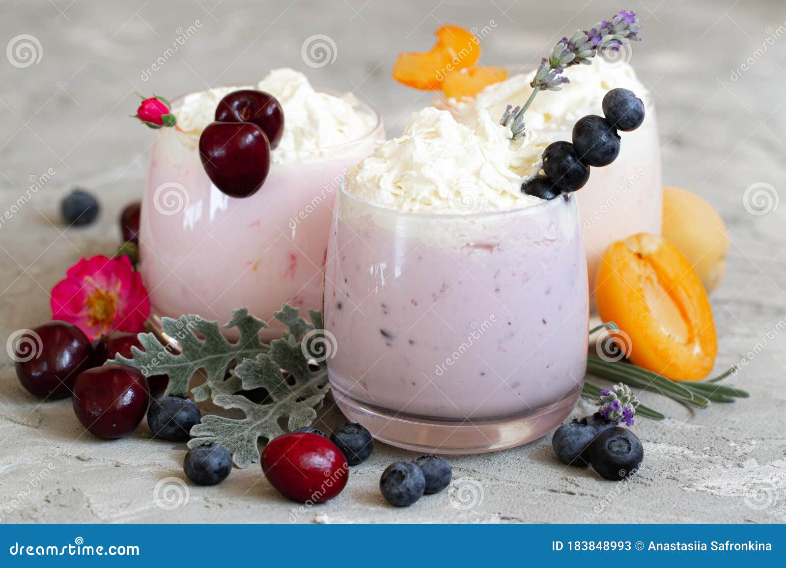 cherry, blueberry, apricot smoothie on light background. well being and weight loos concept. milkshake with fresh berries. healthy