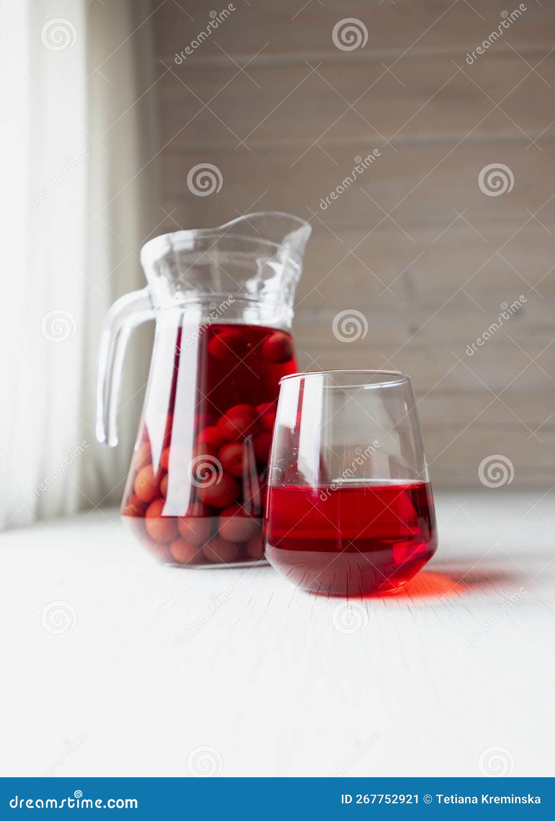 Cherry Compote in a Glass Jug. National Fruit Compote Day. Stock Image
