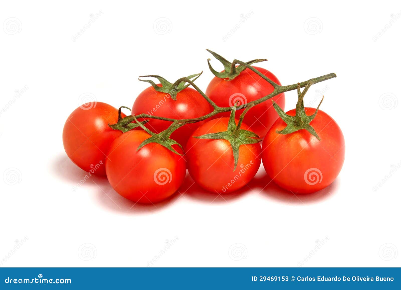 Cherry Tomatoes In An African Ebony Wood Bowl On A Wooden Surface With