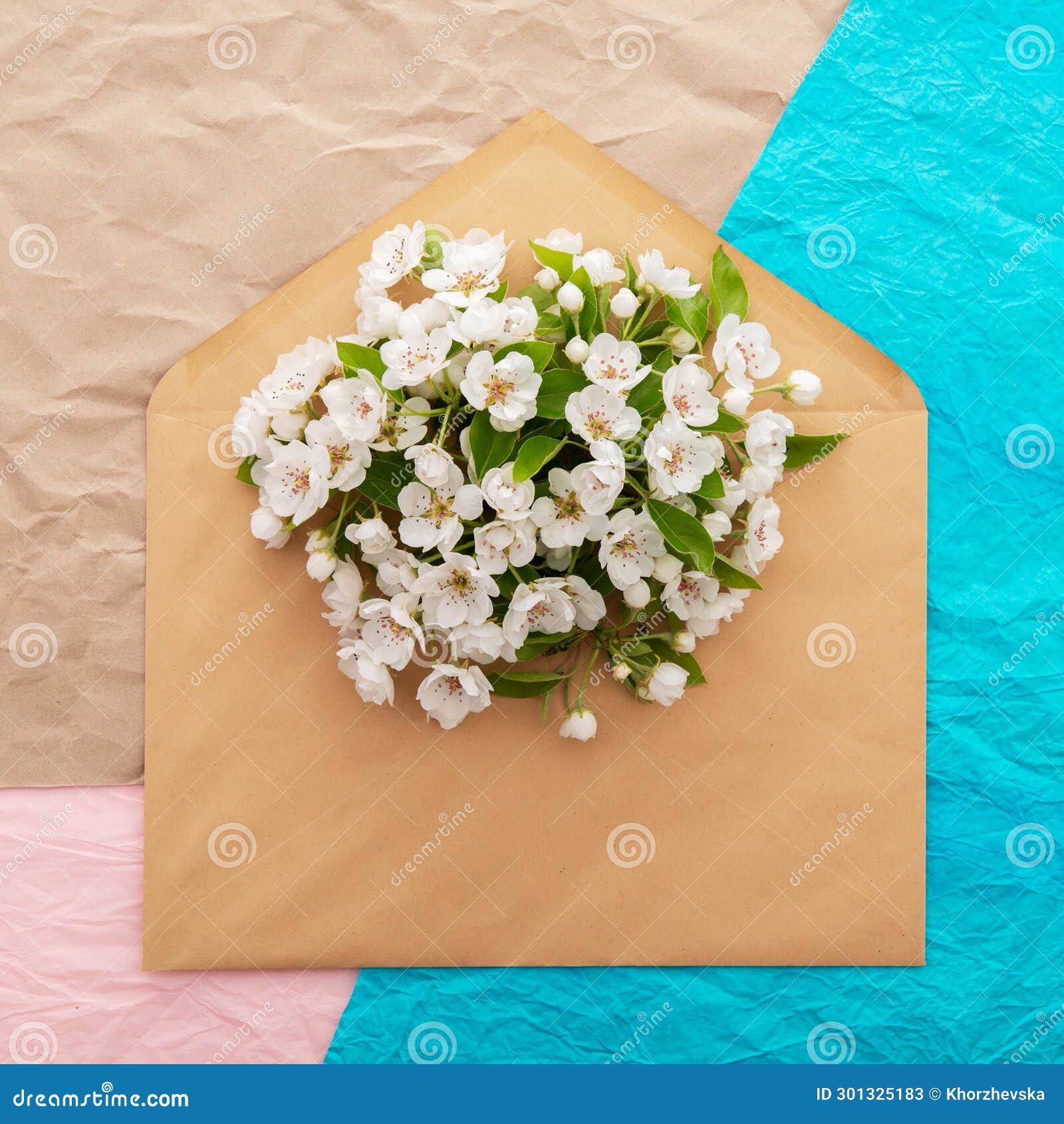cherry tree. envelope with spring flowers over crumpled decorative paper background. springtime 