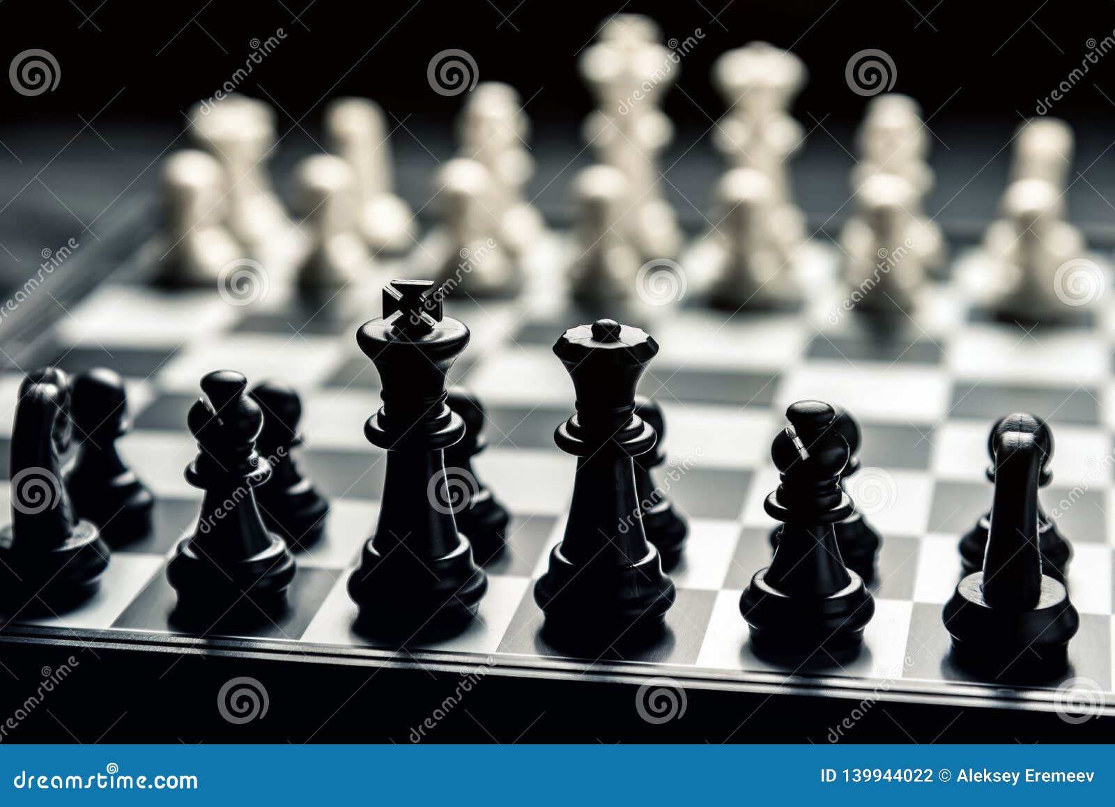 Chess Board With Black And White Chess Facing Each Other Stock Photo