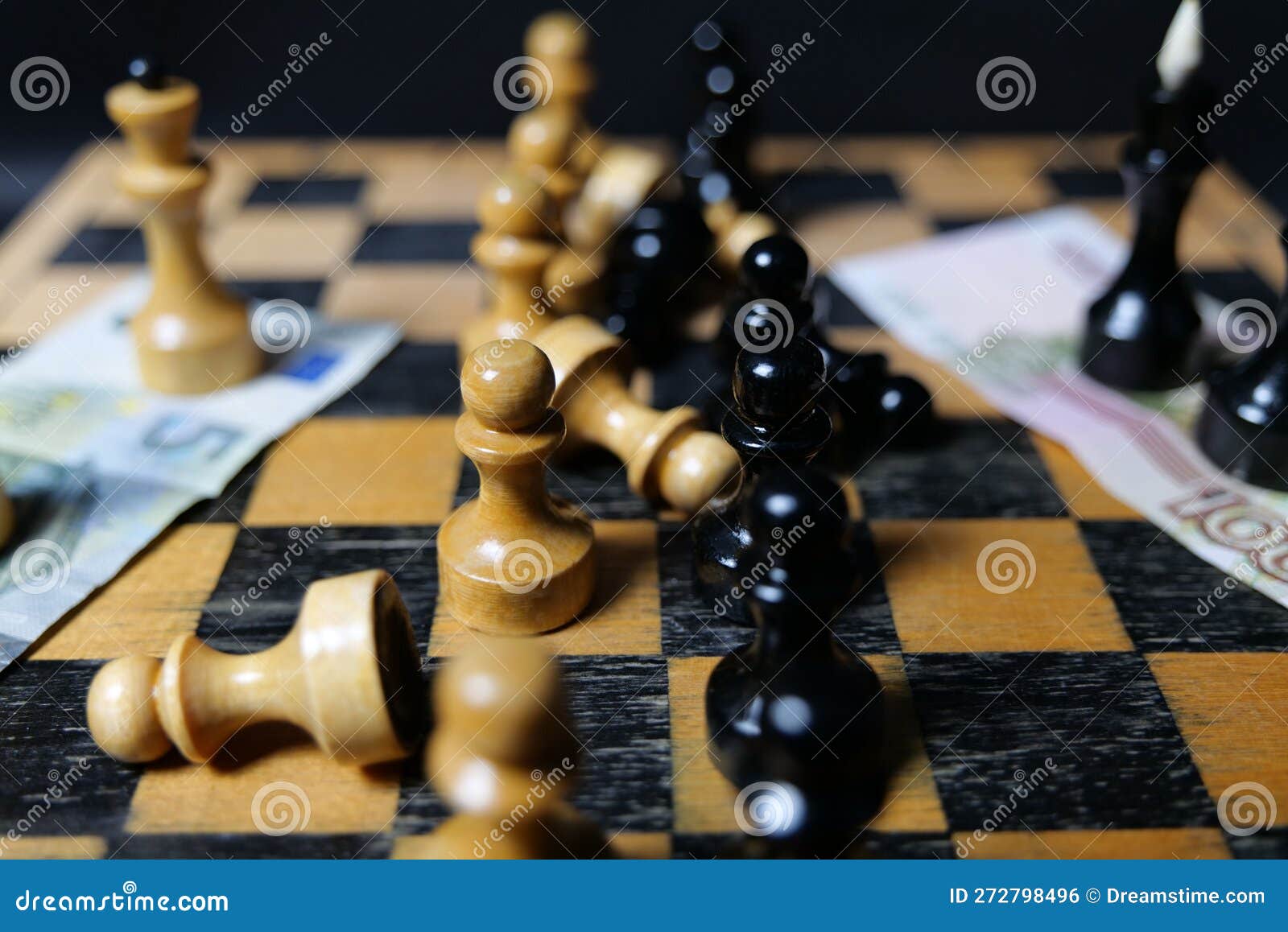 Chess Board with a Variety of Black and White Pieces Scattered Across