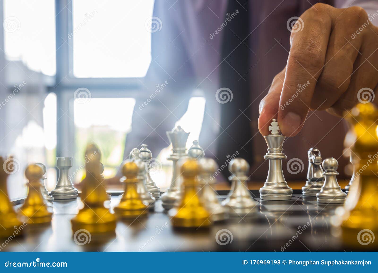 Chess game on chess board behind business man background. Business concept  to present financial information and marketing strategy analysis. Investmen  Stock Photo - Alamy