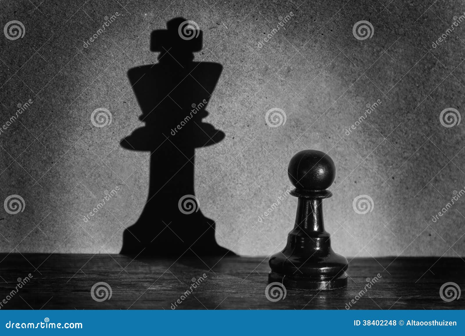 chess pawn standing in a spotlight that make a shadow actistic