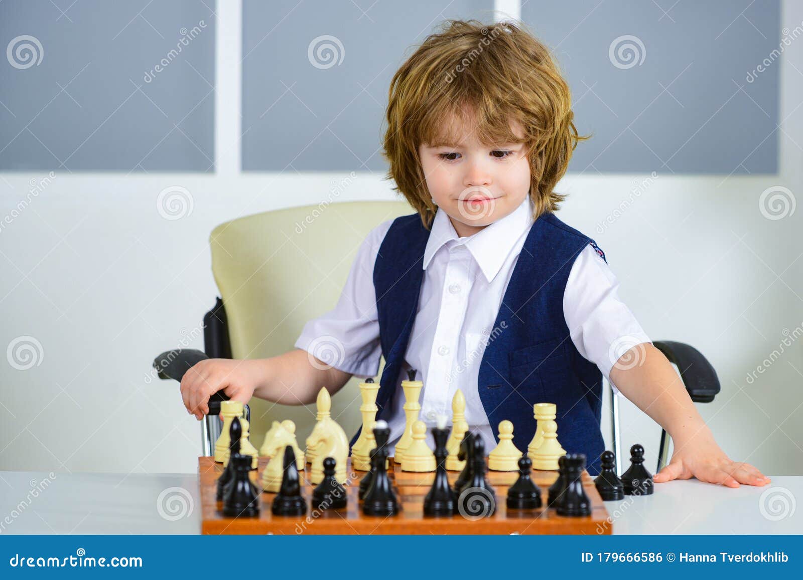 Chess Player, Smart Boy. Logical Thinking. Quarantine Games. Chess. Boy Puts Pieces on a