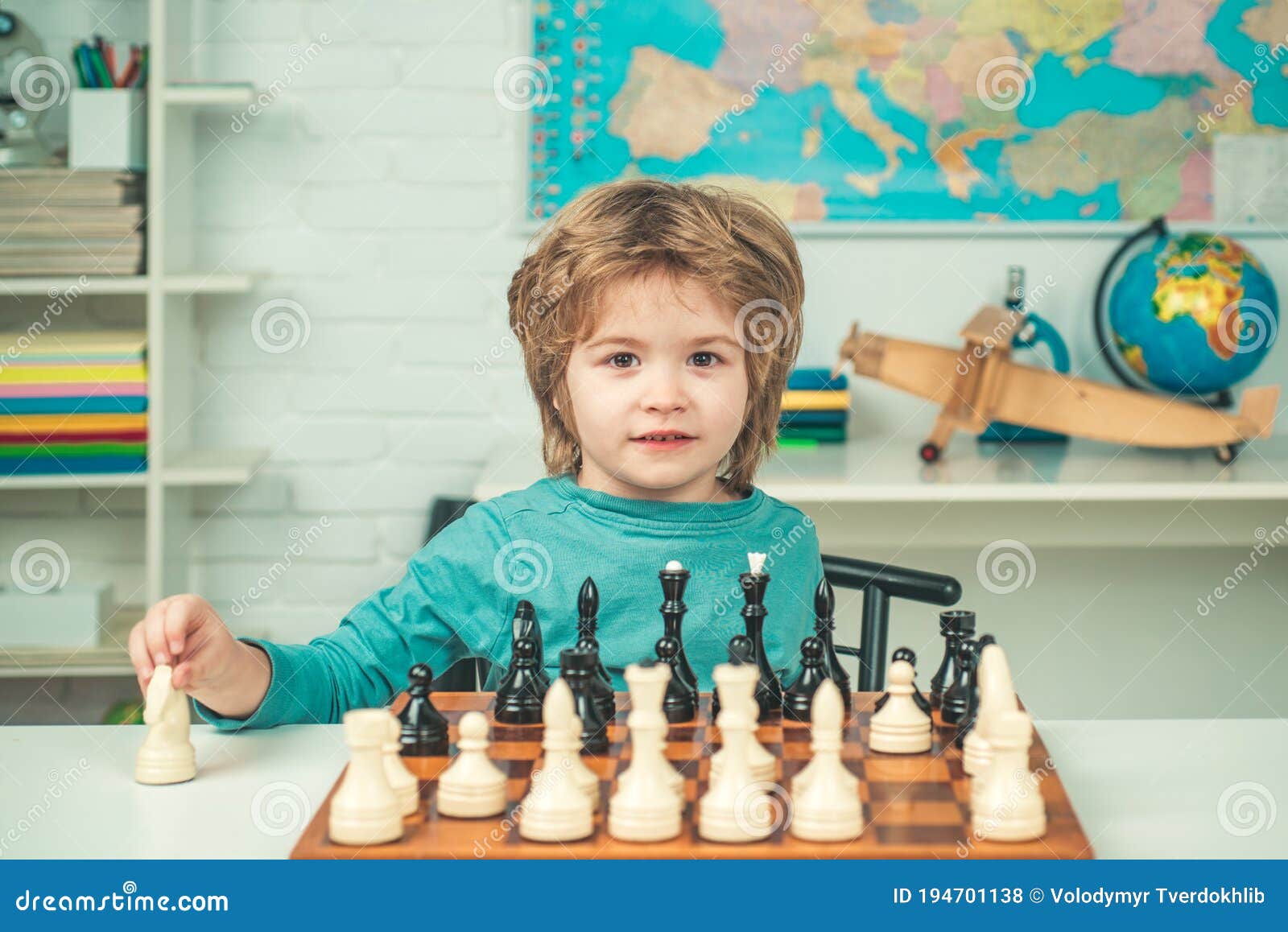 Pupil Kid Thinking About His Next Move In A Game Of Chess. Clever  Concentrated And Thinking Child While Playing Chess. Little Clever Boy  Thinking About Chess. Games Good For Brain Intelligence. Stock