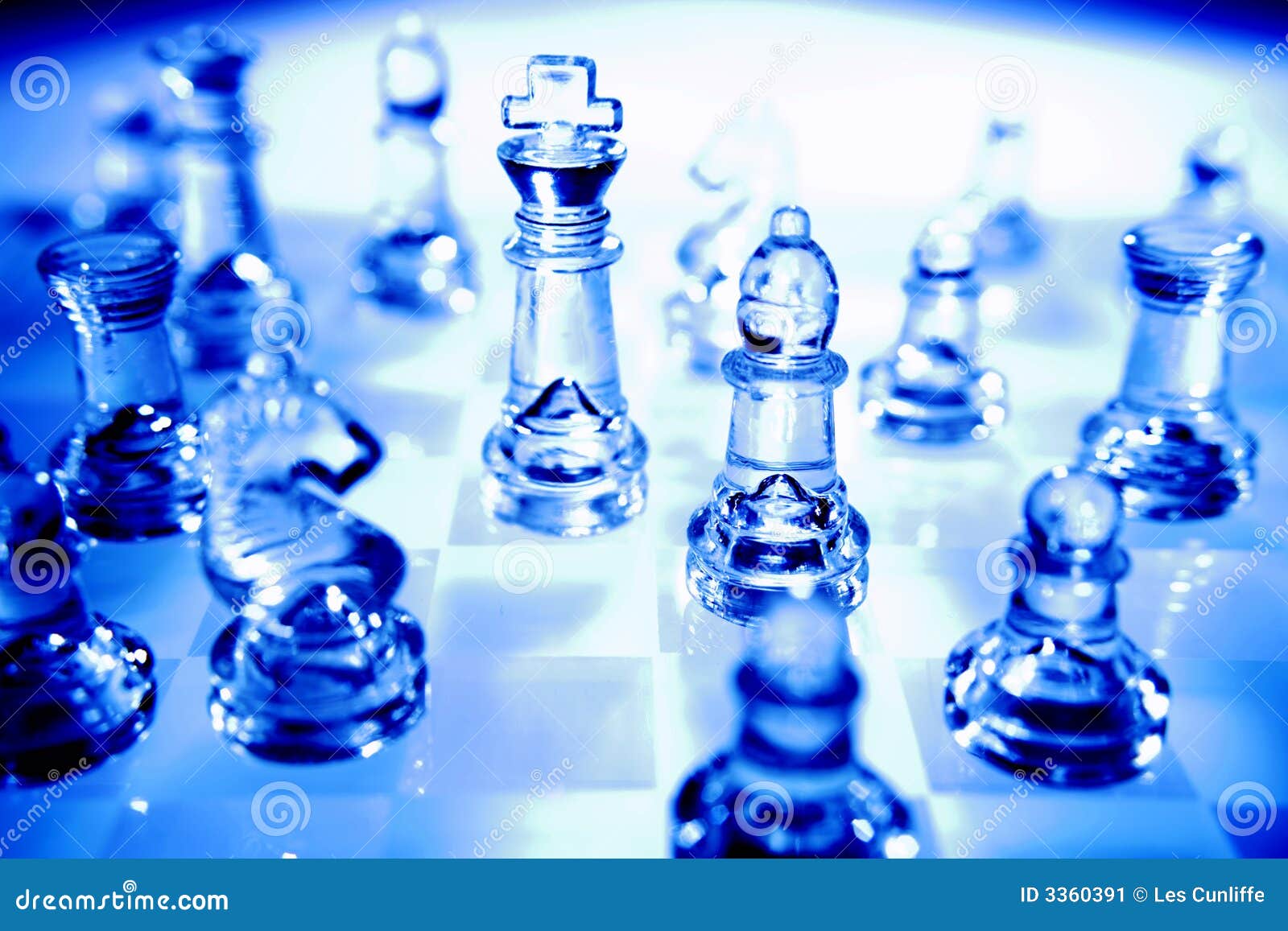 Chessboard glass pieces. Bishops blue castle chessboard cool glass king knights life pawns pieces queen still tones visible