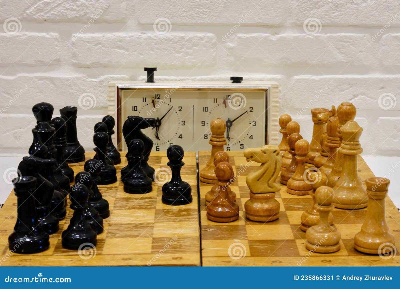 Chessboard with the Queen Gambit Opening and a Clock Showing the