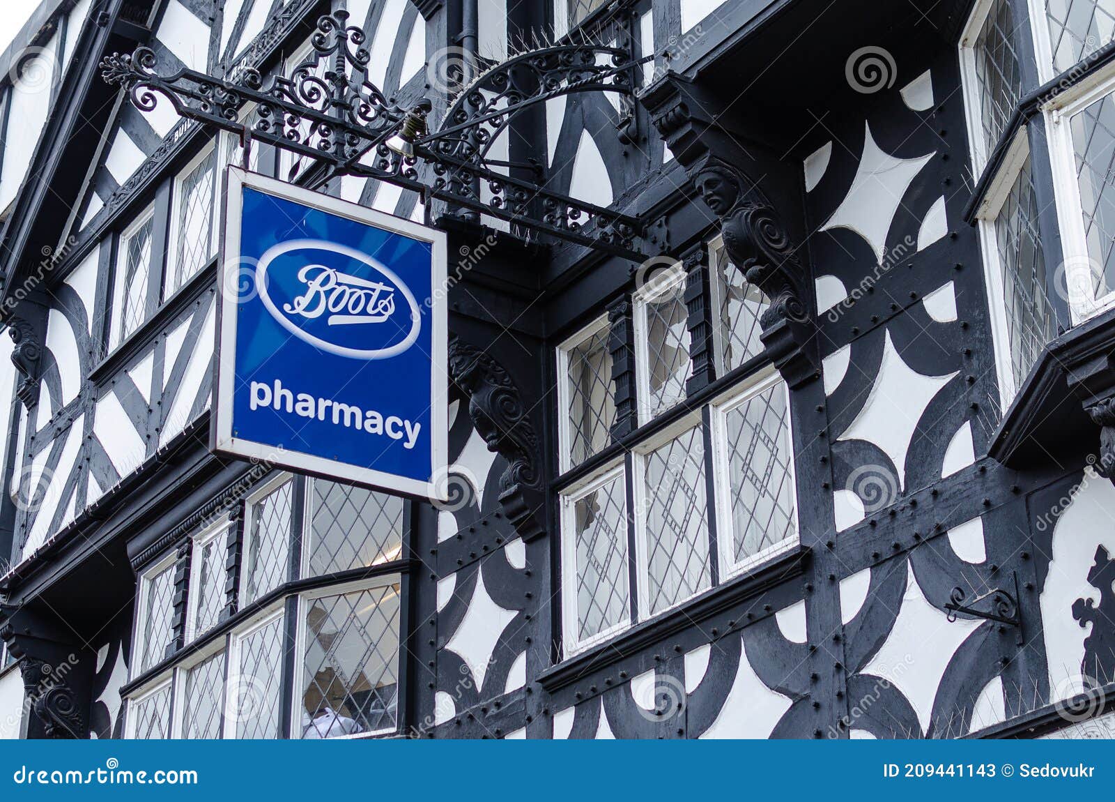 Boots Pharmacy Logo Seen in the Street in Chester Editorial Stock Photo