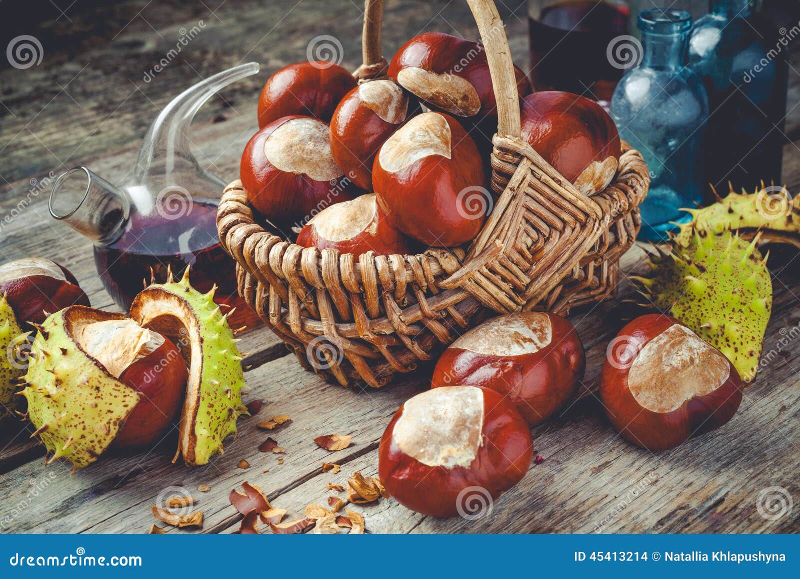 chestnuts in basket and vials with tincture