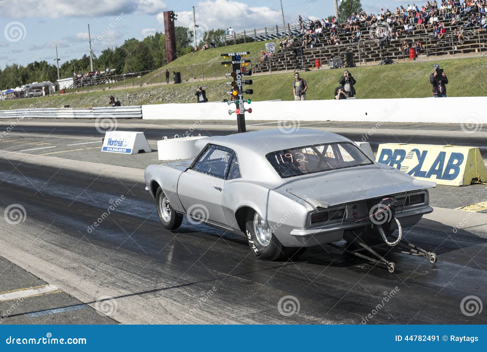 Drag racing. Sanair september 6-7, 2014 rear side view picture of chevrolet camaro making a wheelie on the green light during festidrag event.