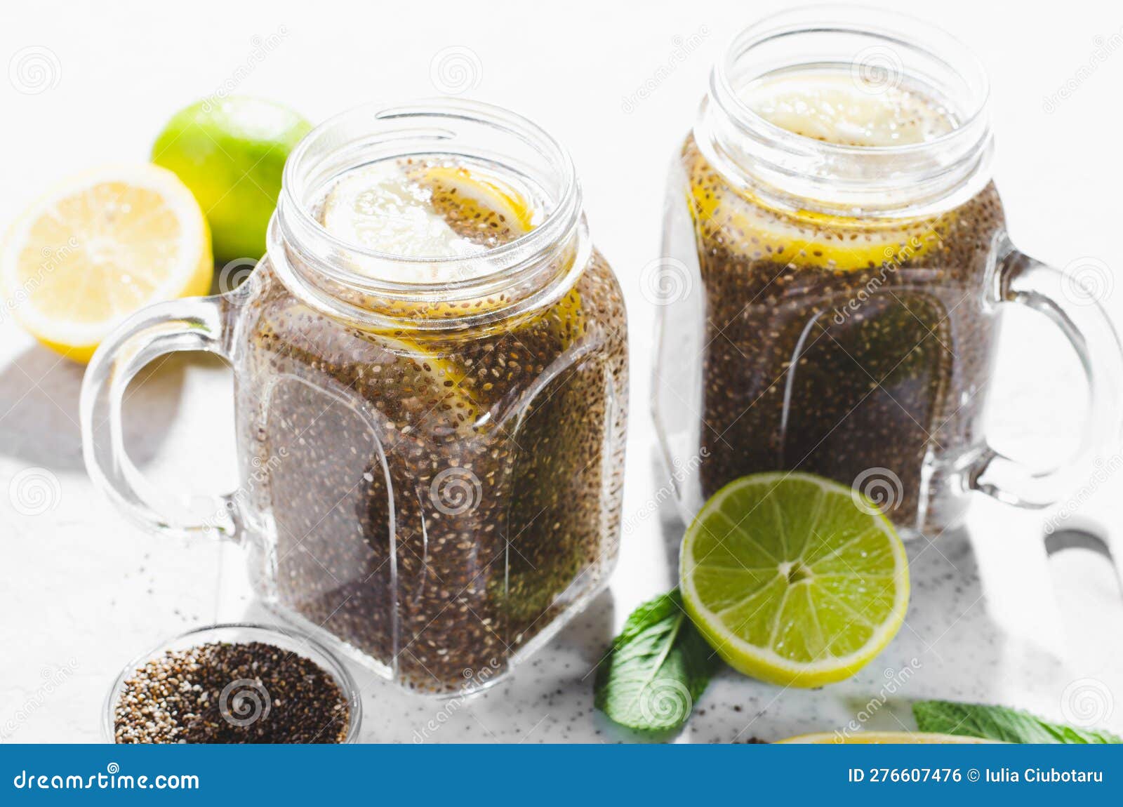Chia Infused Water with Lemon and Lime in Jars, Healthy Citrus Drink on