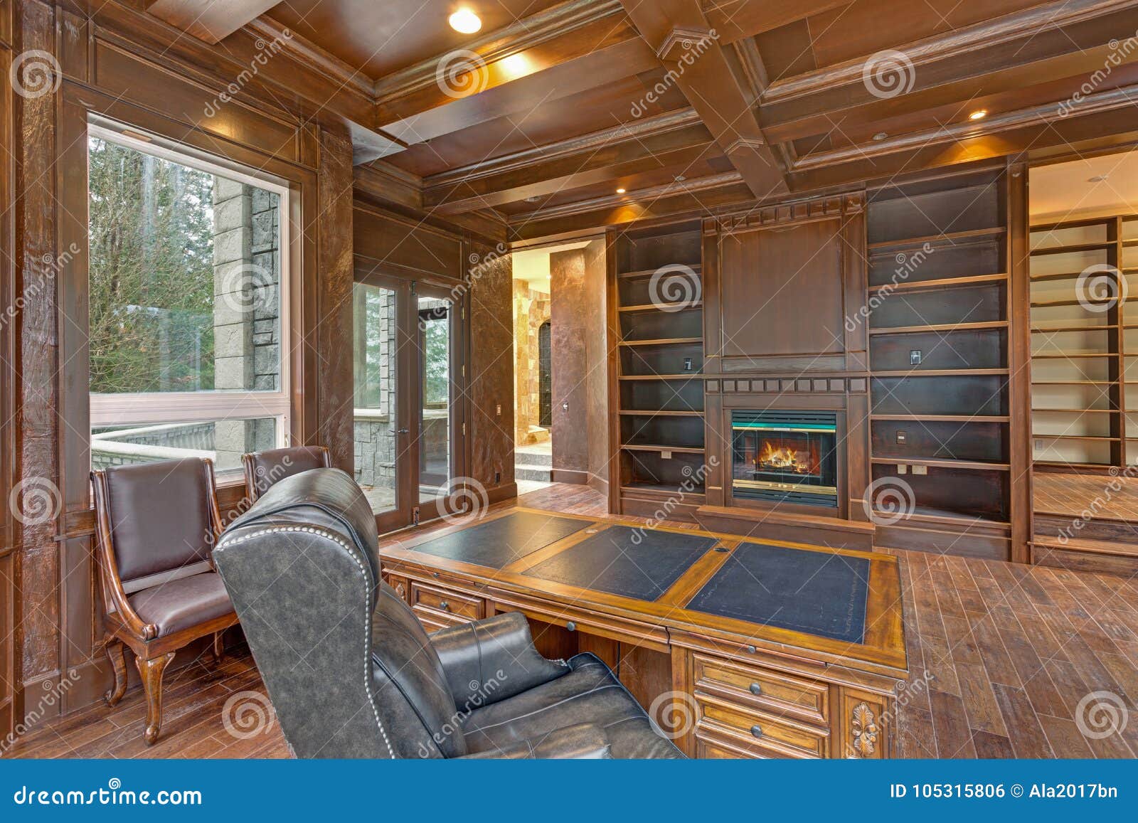 Chic Wood Paneled Home Office Features Coffered Ceiling Stock