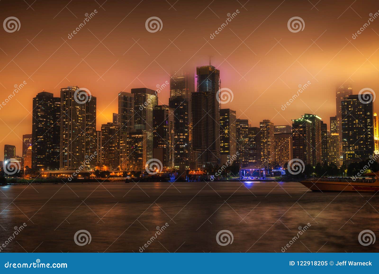 chicago cityscape at night with the fog rolling in