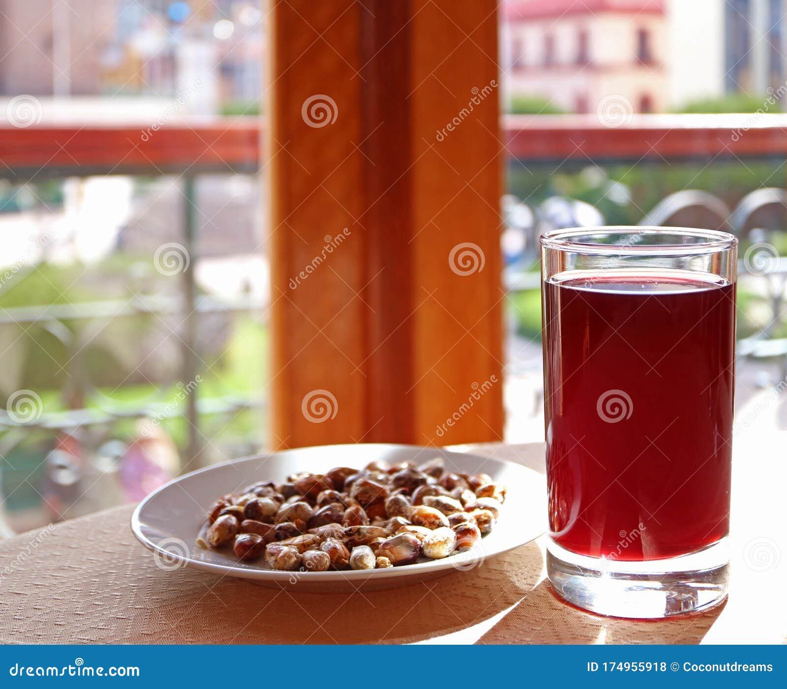chicha morada, the andean traditional beverage made from corn served with toasted corn kernels cancha