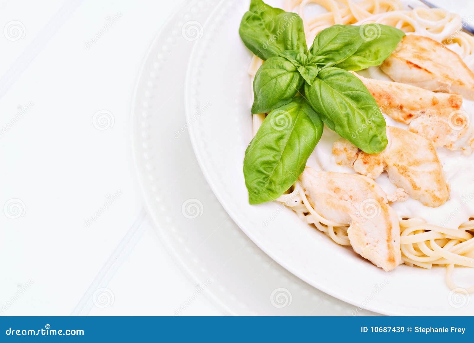Chicken alfredo with basil stock image. Image of background 10687439