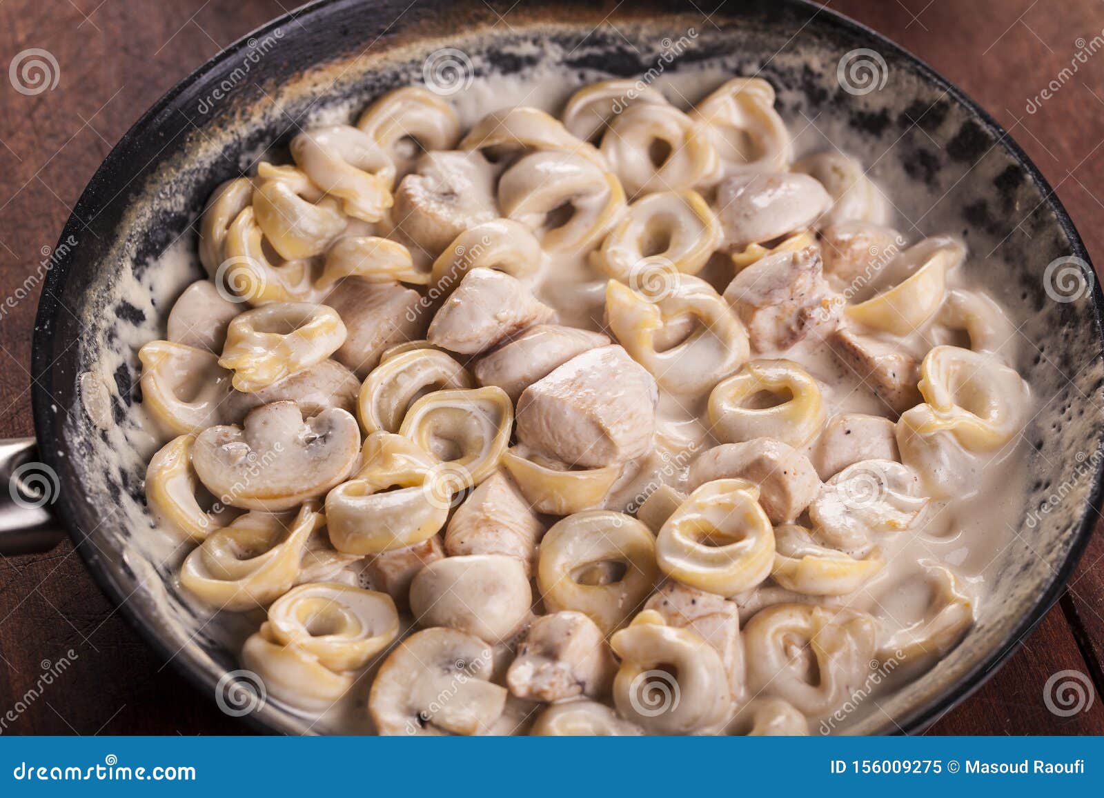 chicken alfredo pasta souce in coocking plaste