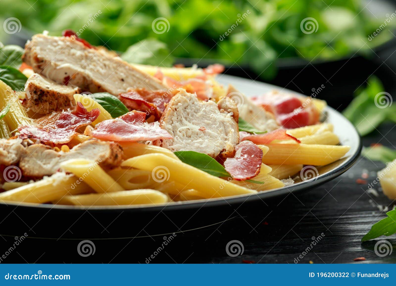Chicken, Bacon Penne Pasta with Parmesan Cheese and Basil. Healthy Food