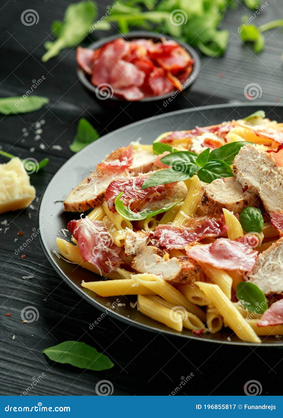Chicken, Bacon Penne Pasta with Parmesan Cheese and Basil. Healthy Food