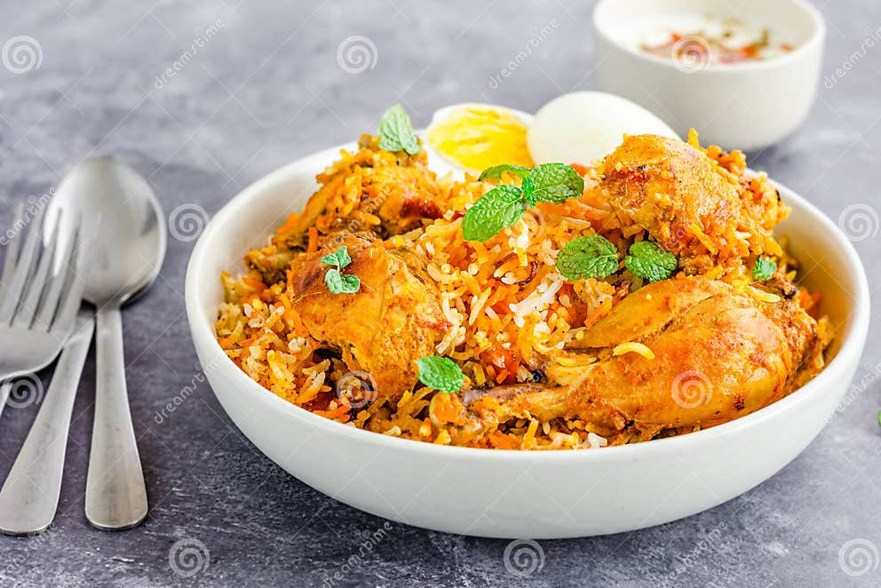 Chicken Biryani with Raita and Eggs on Dark Background Horizontal Photo ...