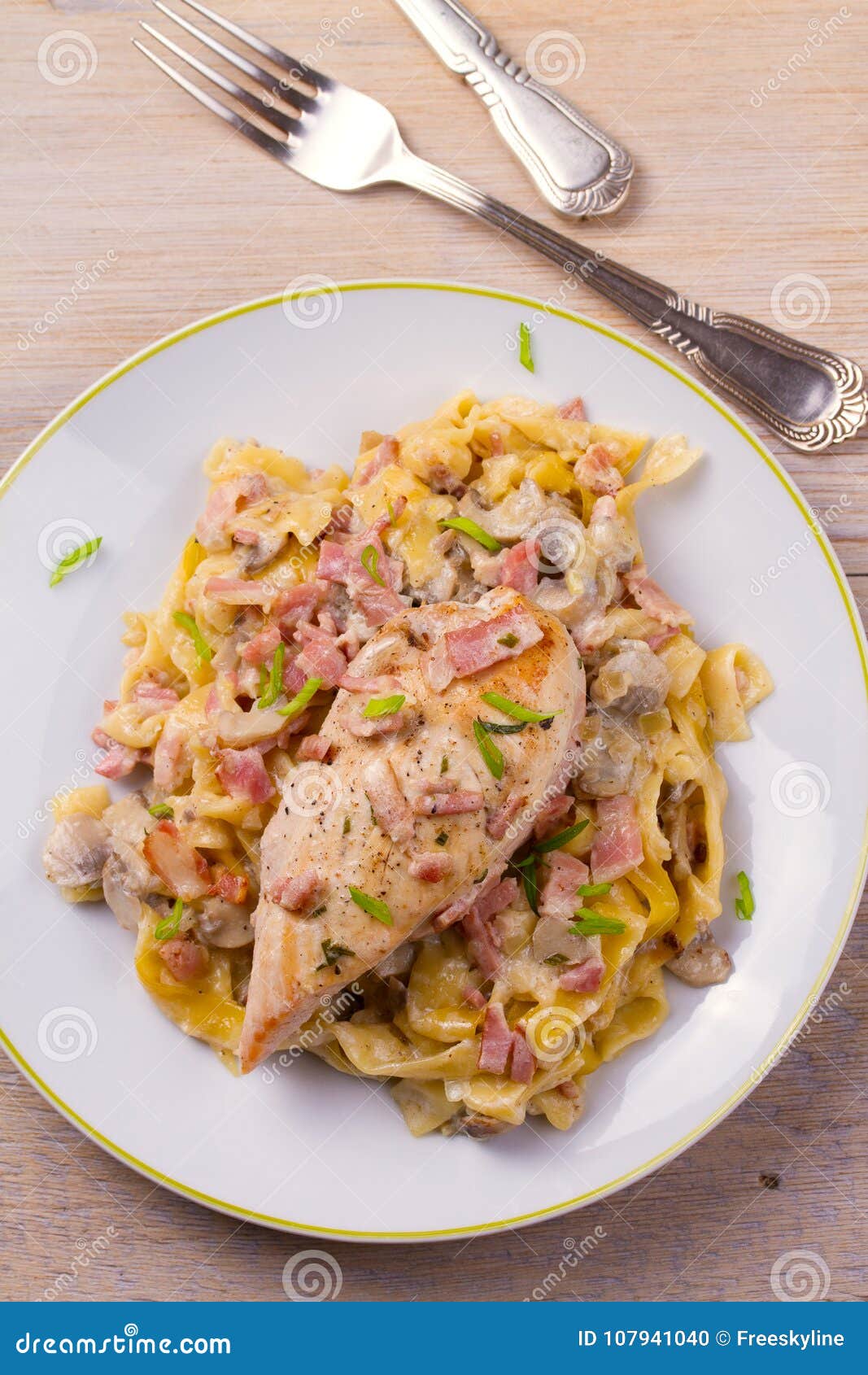 Chicken Breast and Egg Noodles with Bacon and Mushrooms in Creamy Sauce