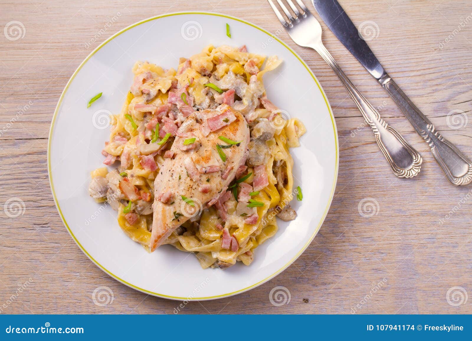 Chicken Breast and Egg Noodles with Bacon and Mushrooms in Creamy Sauce