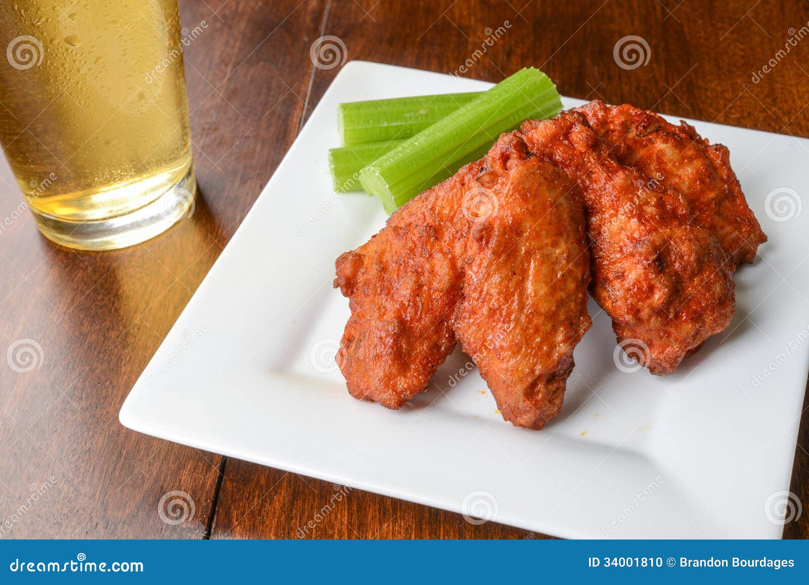 Chicken Buffalo Wings and a Beer Stock Photo Image of cooked, cheese