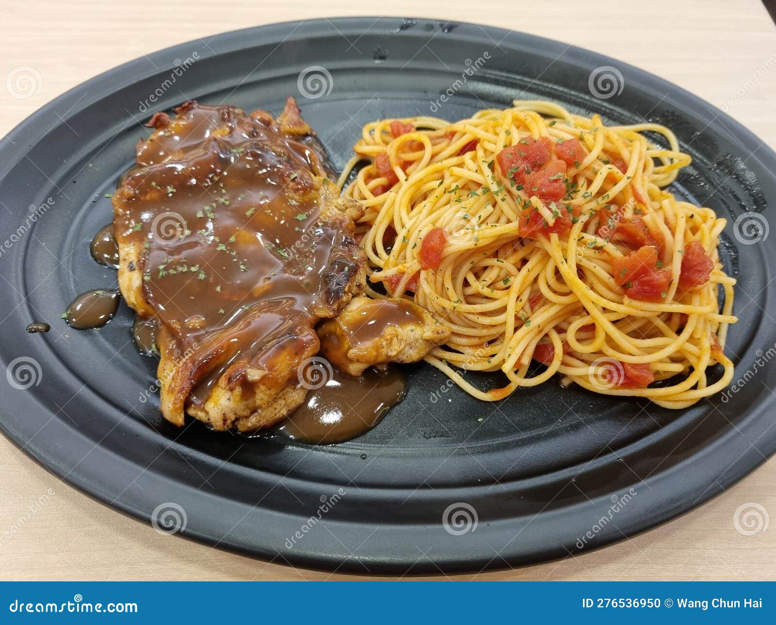 Chicken Chop with Black Pepper Sauce and Spaghetti Stock Photo Image