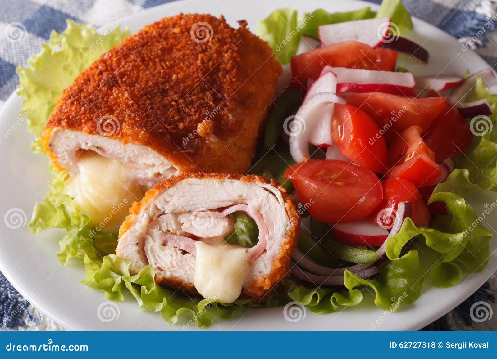 Chicken Cordon Bleu and Vegetable Salad Closeup. Horizontal Stock Photo ...