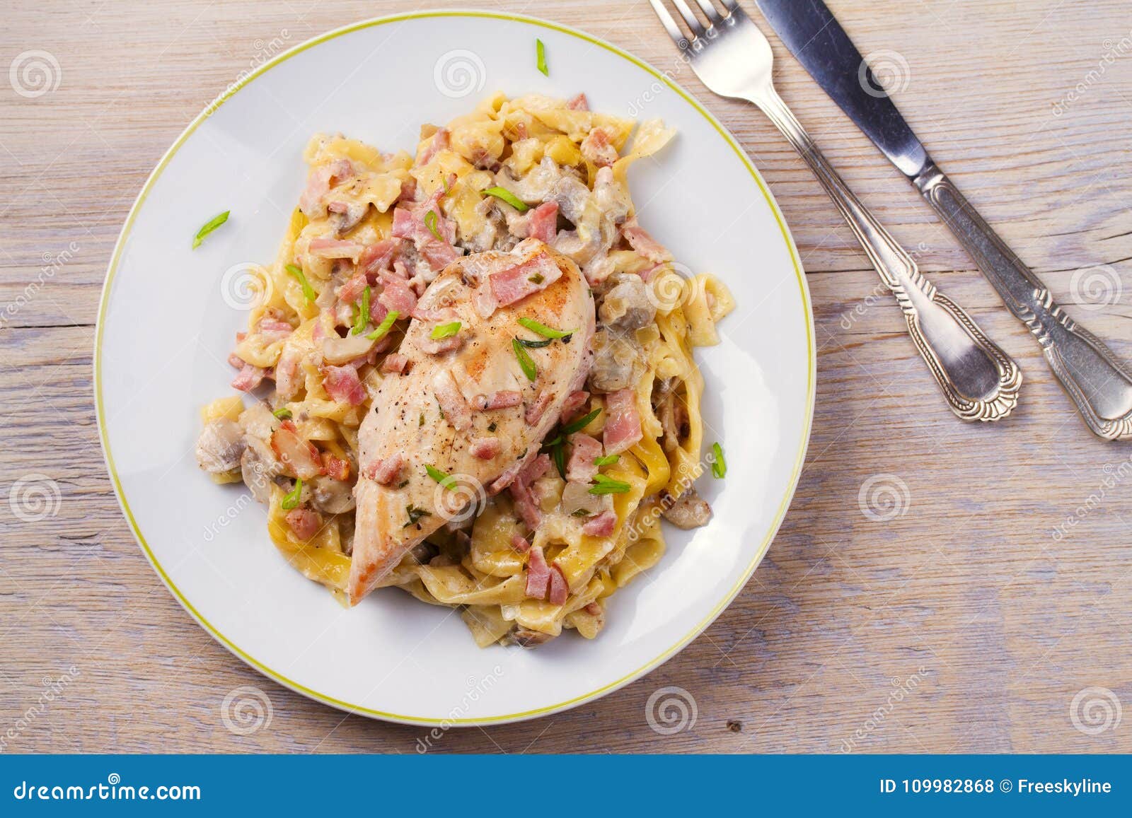 Chicken and Creamy Bacon and Mushroom Pasta. Stock Photo - Image of