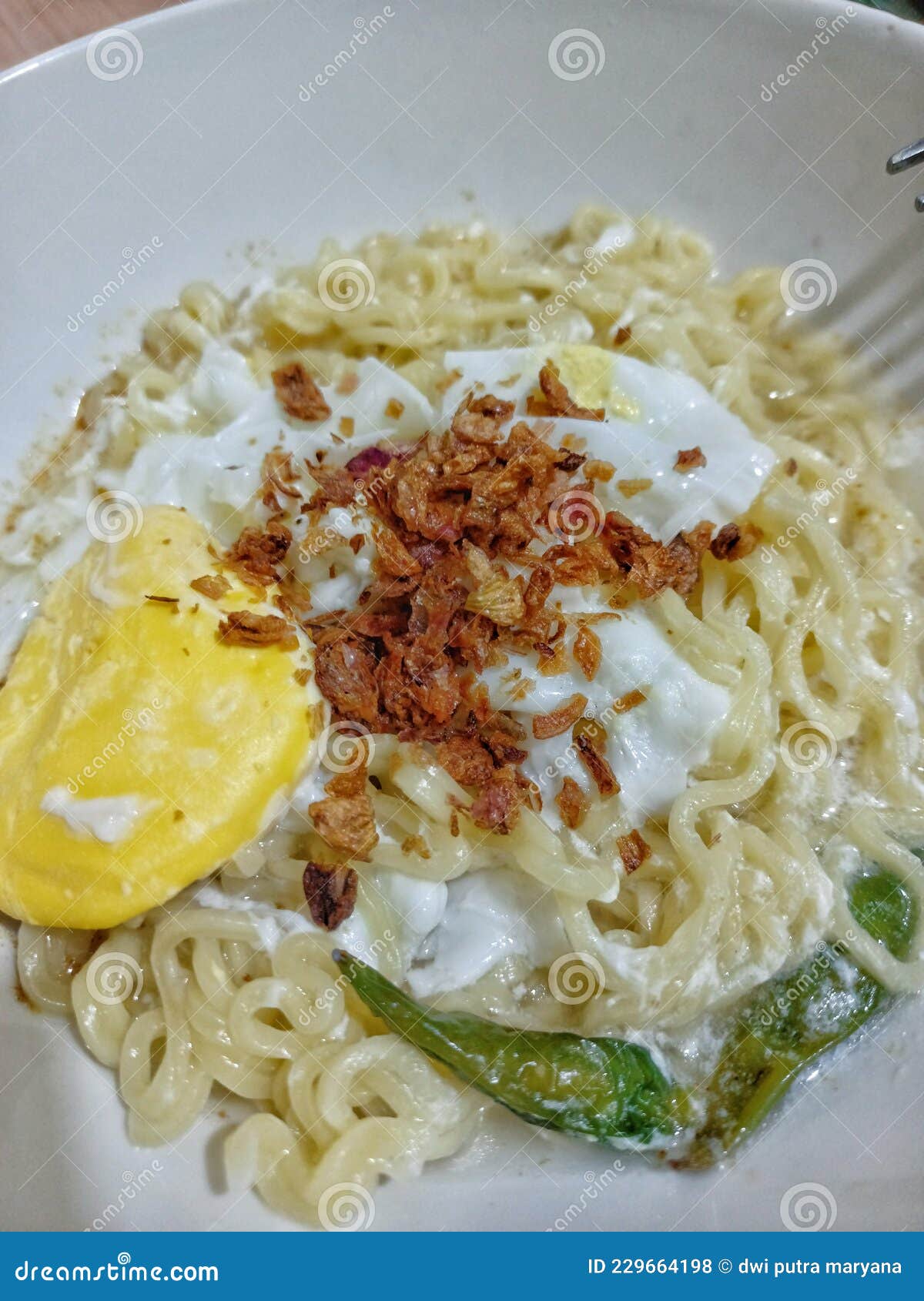 Chicken Curry Instant Noodles with Fried Onions, Eggs, and Cayenne