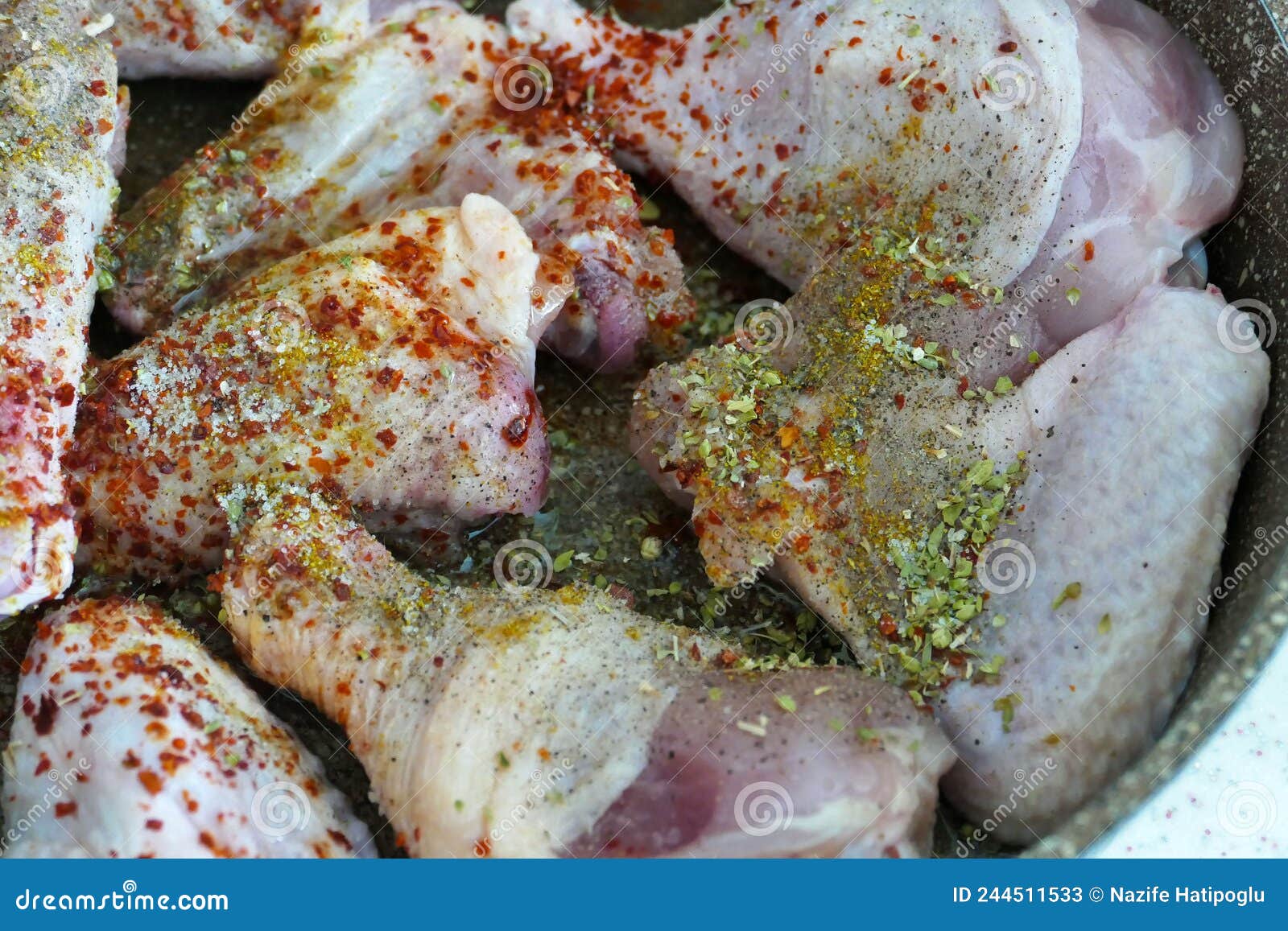 Chicken Drumstick Sauced with Pepper, Salt and Dried Thyme in a Pan