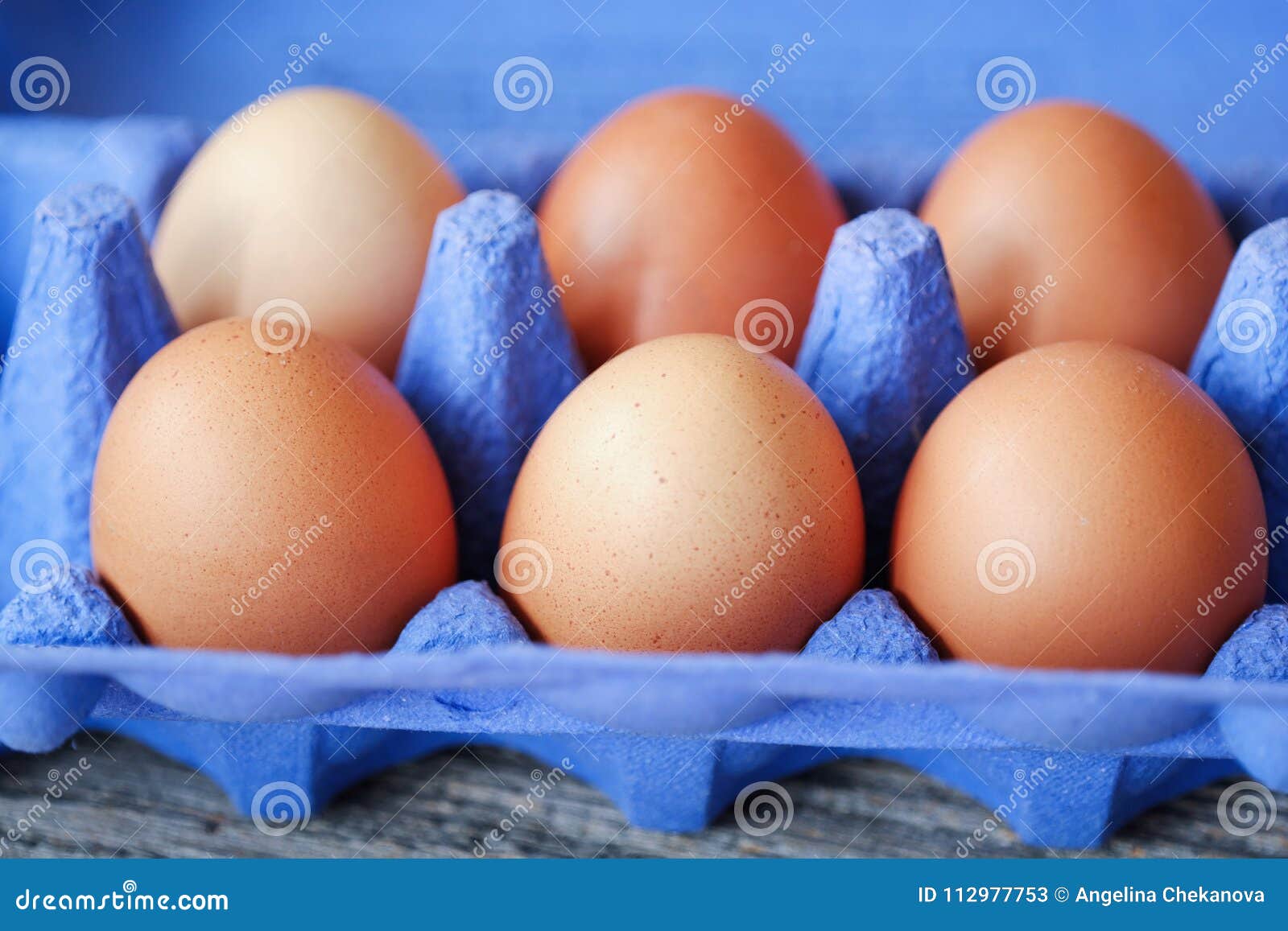 Chicken Eggs In The Purple Package On The Table Stock ...