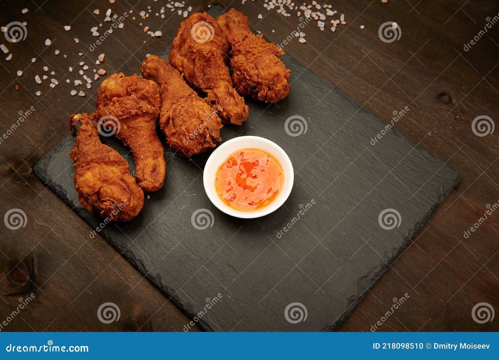 Chicken Legs, Breaded Fast Food on a Plate with Sauce Stock Photo